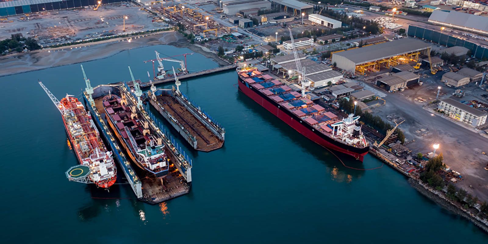Airial view of a dockyard with large container ships at dock