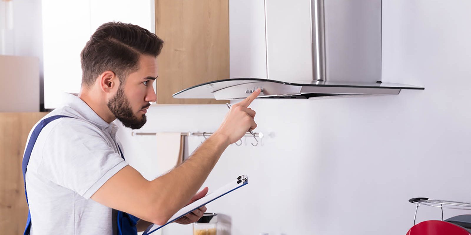 Electrician working on a kitchen oven