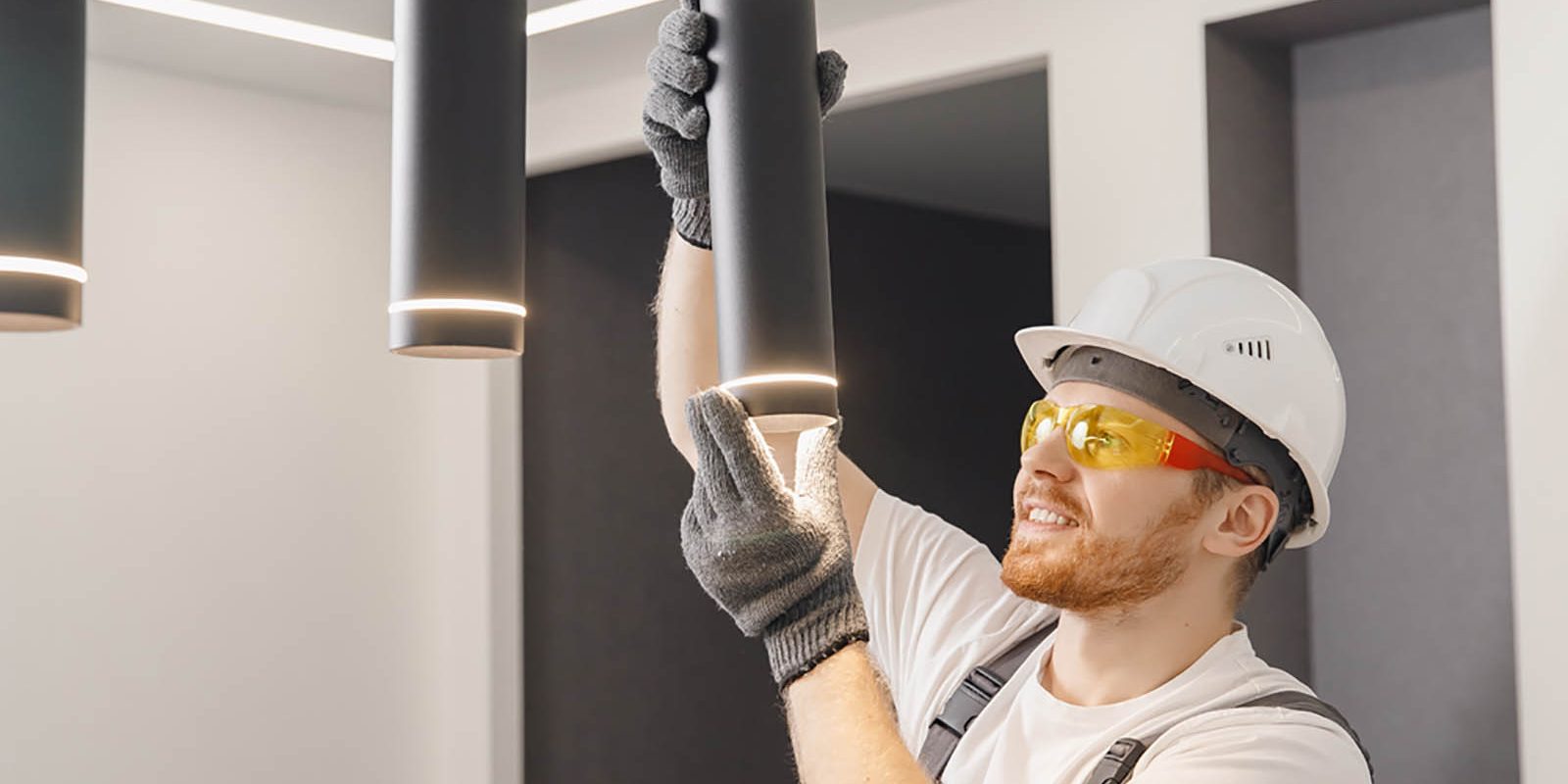 Electrician installing some light fixtures